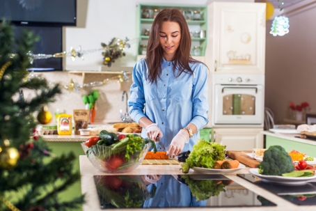 Woman making a nutritious and tasty meal during the holidays. | Soza Weight Loss